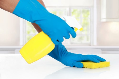 Technician reviewing cancellation and access arrangements for a cleaning job